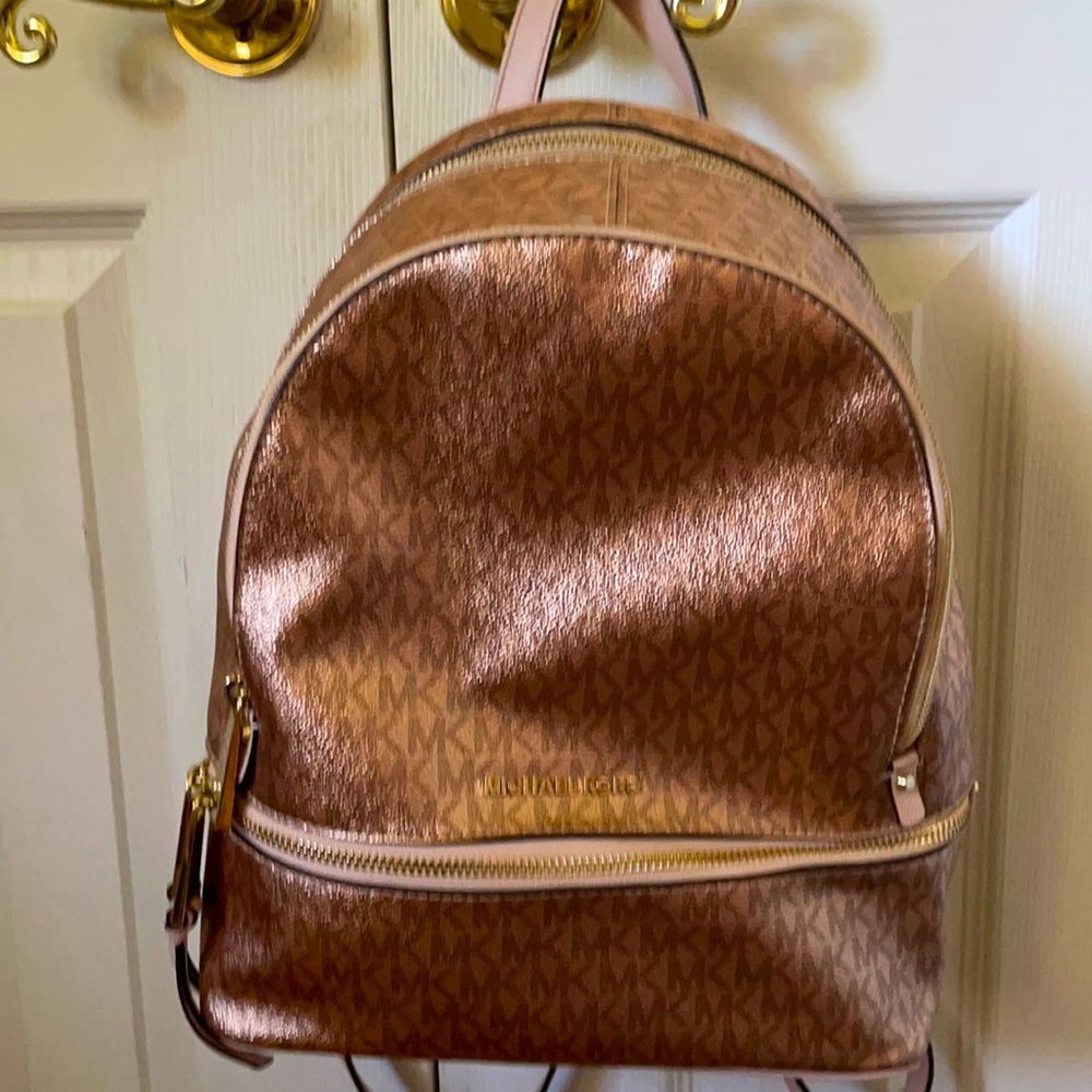 Michael Kors Backpack with long straps in bronze color.  3 zipper compartments.